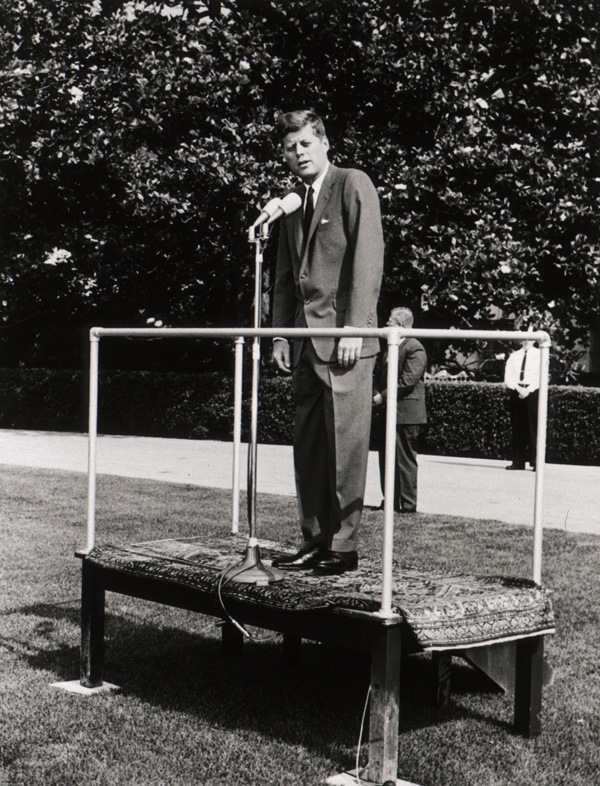 Photo of John F Kennedy speaking about the NLM in June 1963