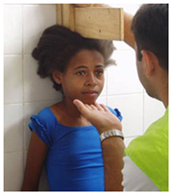 Zero Hunger team member measures height of young girl