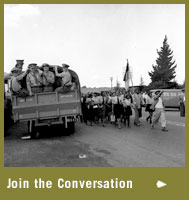 Nurses  march past South African military truck