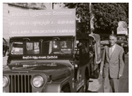 Eugene Paul Campbell stands next to jeep