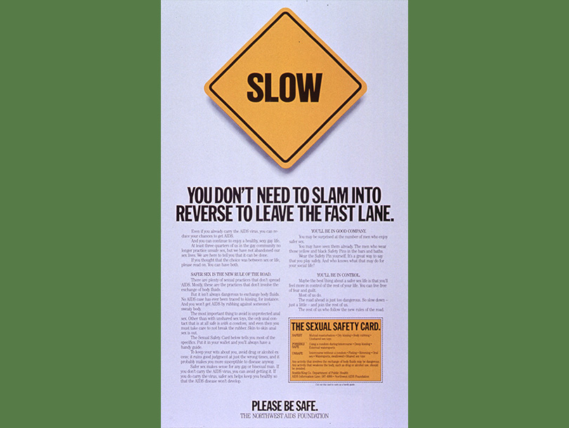 Yellow square road sign that says Slow above text