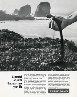 Magazine ad featuring a photograph of a hand grabbing dirt and particles spilling out back onto a beach.