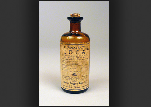 Photograph of a bottle with coca extract.