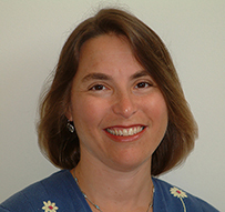 Dr. Jill Nina Afrin, a White female with cropped hair, smiling at the camera.
