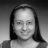 Dr. Consuelo E. M. Carmona, a Hispanic and American Indian female with long dark hair and glasses posing for her portrait.