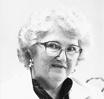 Dr. Carolyn R. Denning, a female with glassed in a suit jacket posing for her portrait.