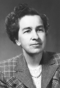 Dr. Harriet Louise Hardy, a female wearing tweed suit jacket posing for her portrait.