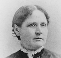 Dr. Clara Marshall, a White female in a collared blouse posing for her portrait.