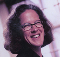 Dr. Laurel Wysong Rice, a smiling White female with short hair posing for her portrait.