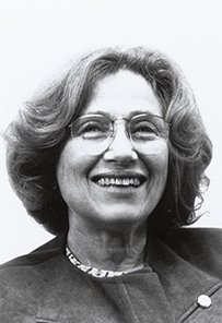 Dr. Carolyn Bauer Robinowitz, a White female with short hair in glasses posing for her portrait.