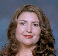 Dr. Laura Ann Williams, a White female in formal attire, posing for her portrait.