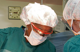 An African American doctor performing surgery